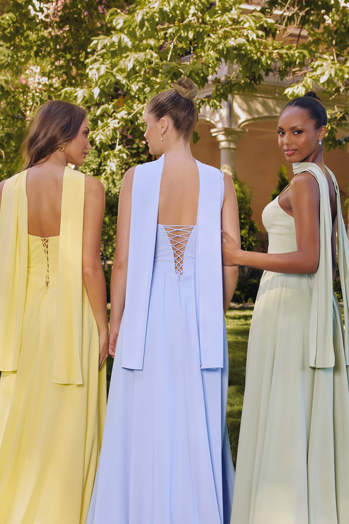 Group portrait of formal dresses with different necklines and skirt silhouettes.