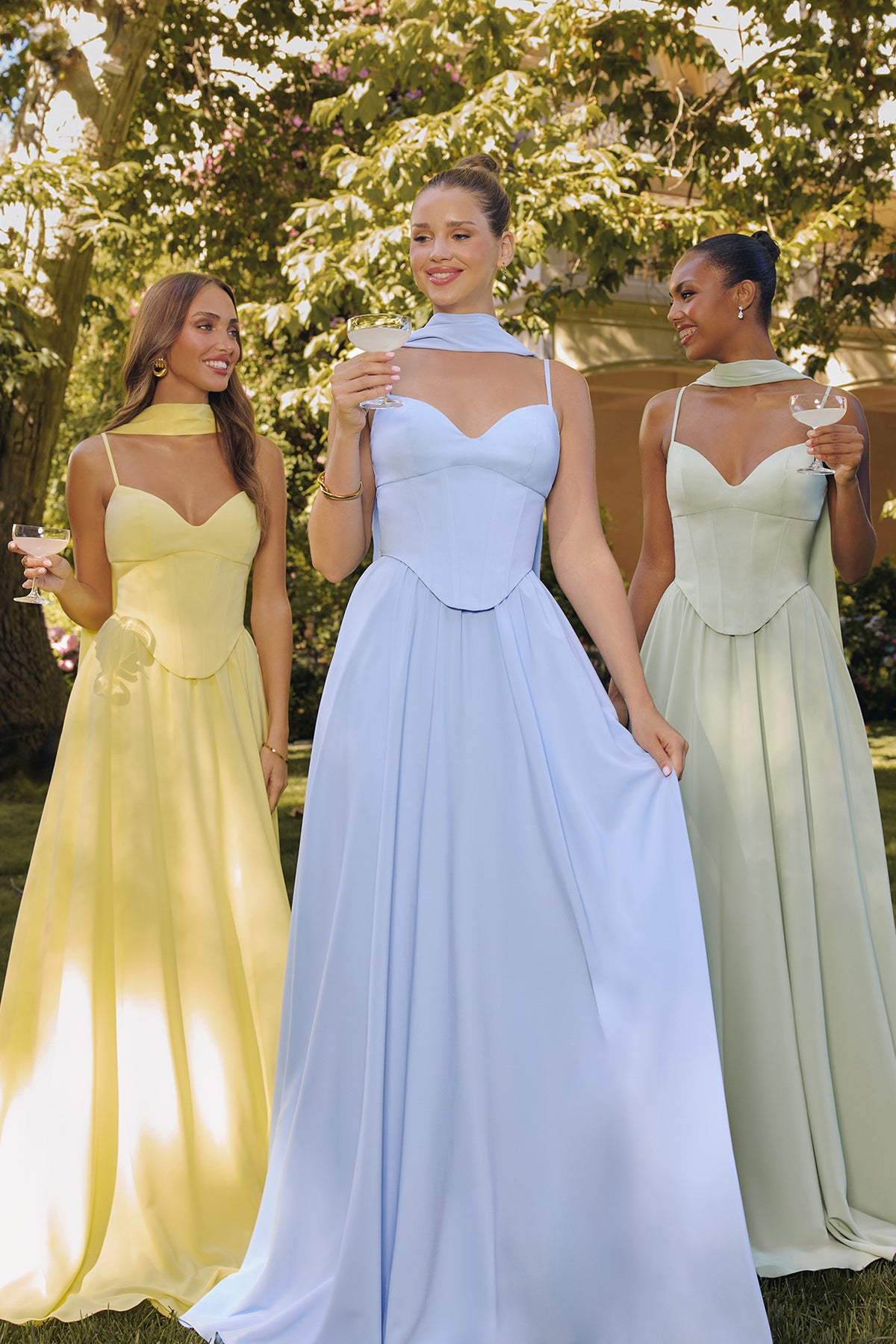 Group portrait of formal dresses with different necklines and skirt silhouettes.