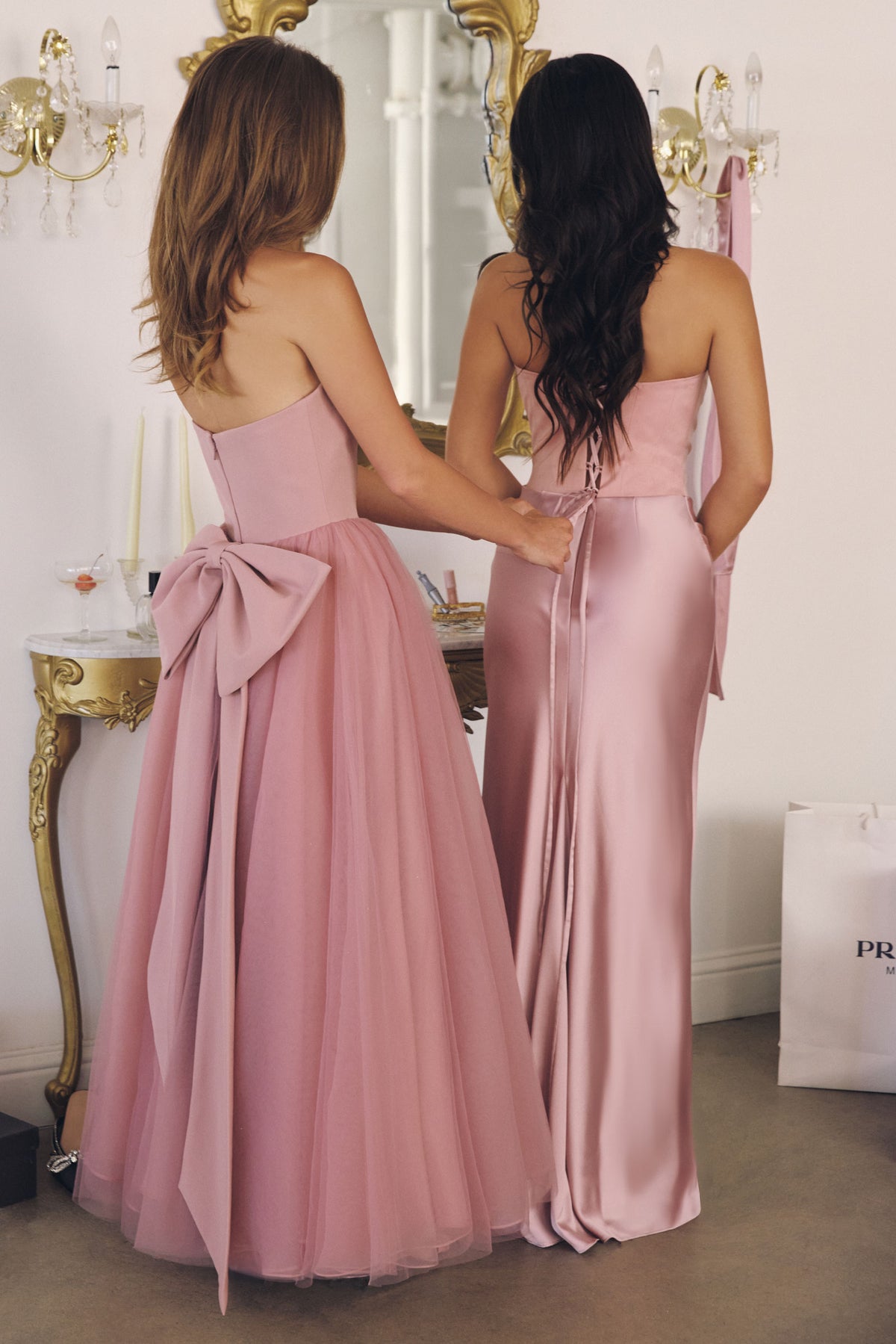 Group portrait of formal dresses with different necklines and skirt silhouettes.