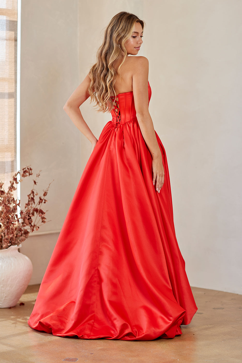 2085 strapless draped slit ball gown, red, back view