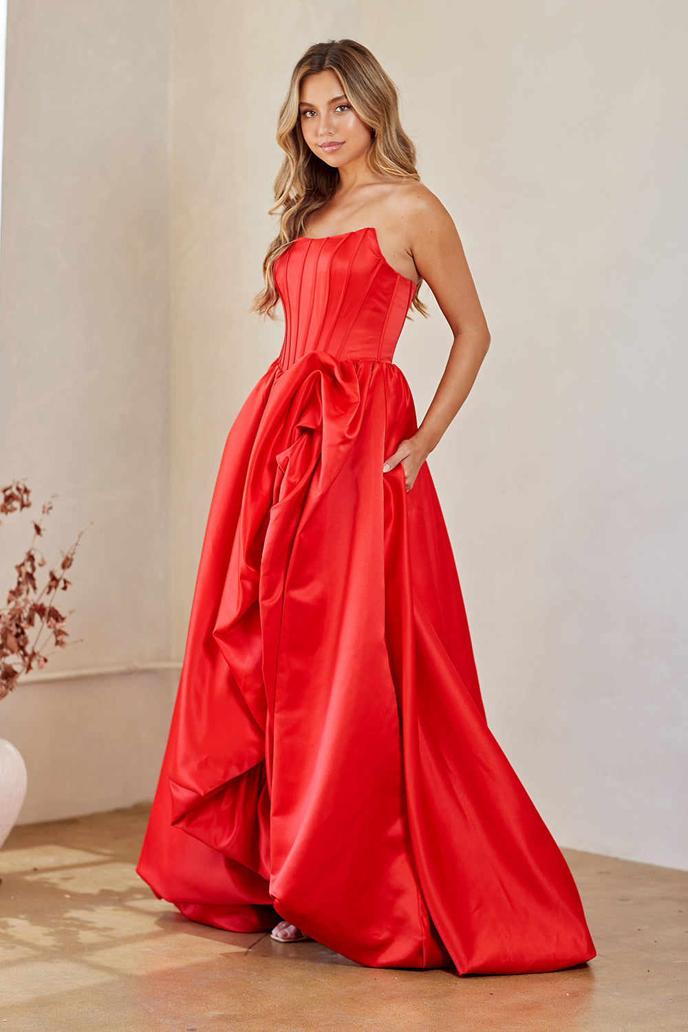 2085 strapless draped slit ball gown, red, front view