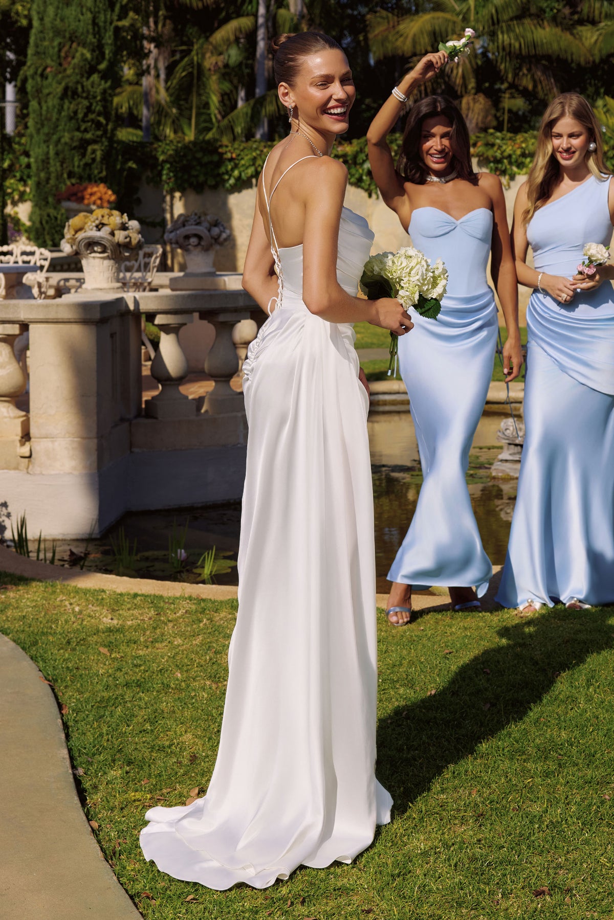 Group portrait of formal dresses with different necklines and skirt silhouettes.